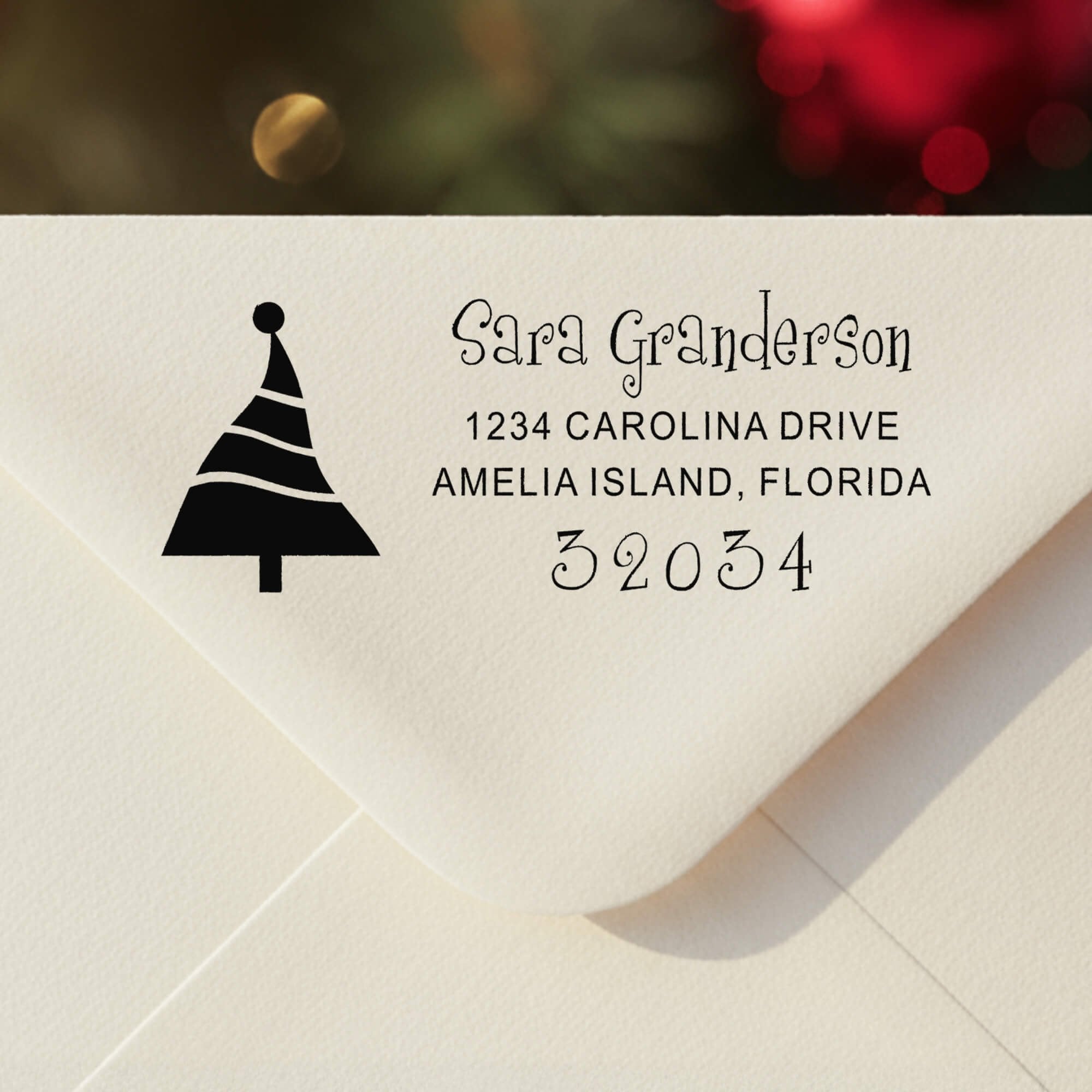 Personalized ‘Dancing Christmas Tree’ address stamp impression on envelope flap for holiday cards.
