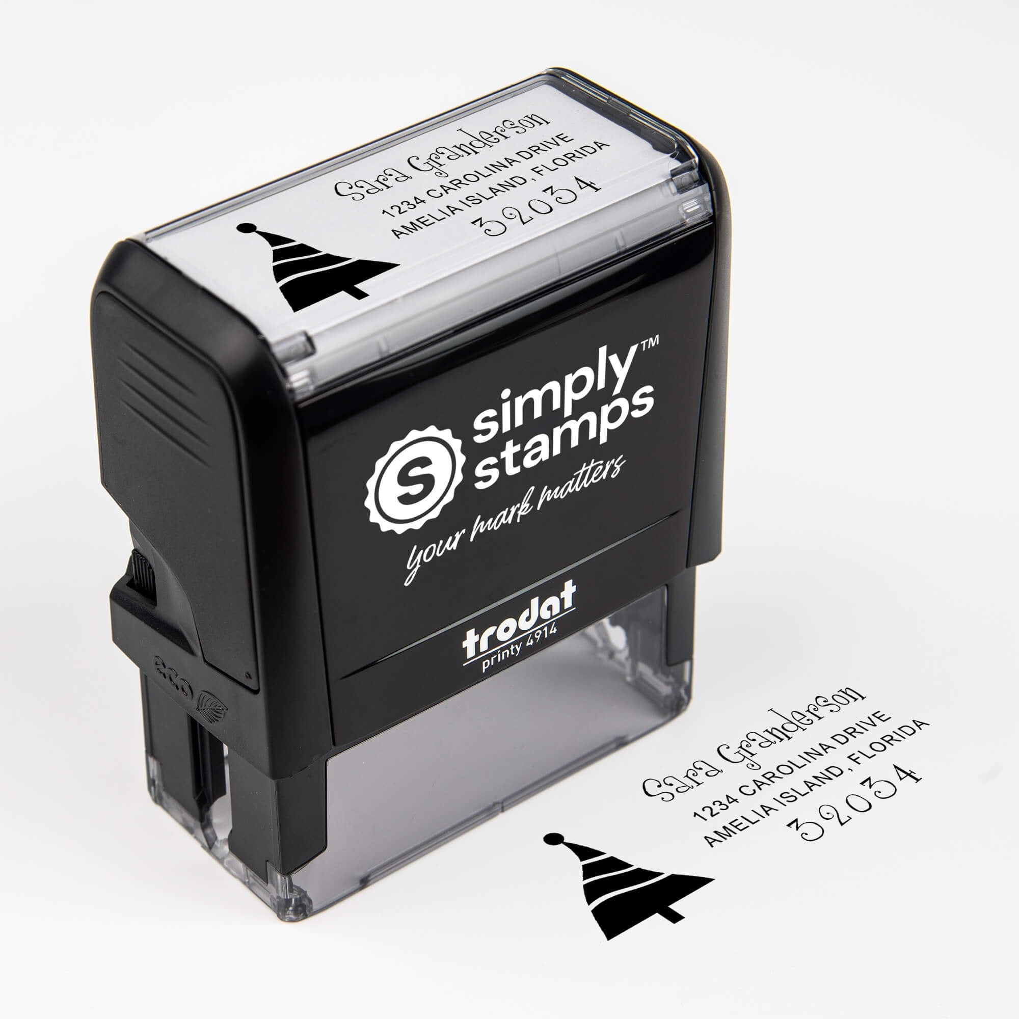 Top angle view of self-inking holiday stamp with circular ‘Dancing Christmas Tree’ address design.