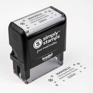 Top angle view of self-inking holiday stamp with circular ‘Manzelli Snowflake’ address design.