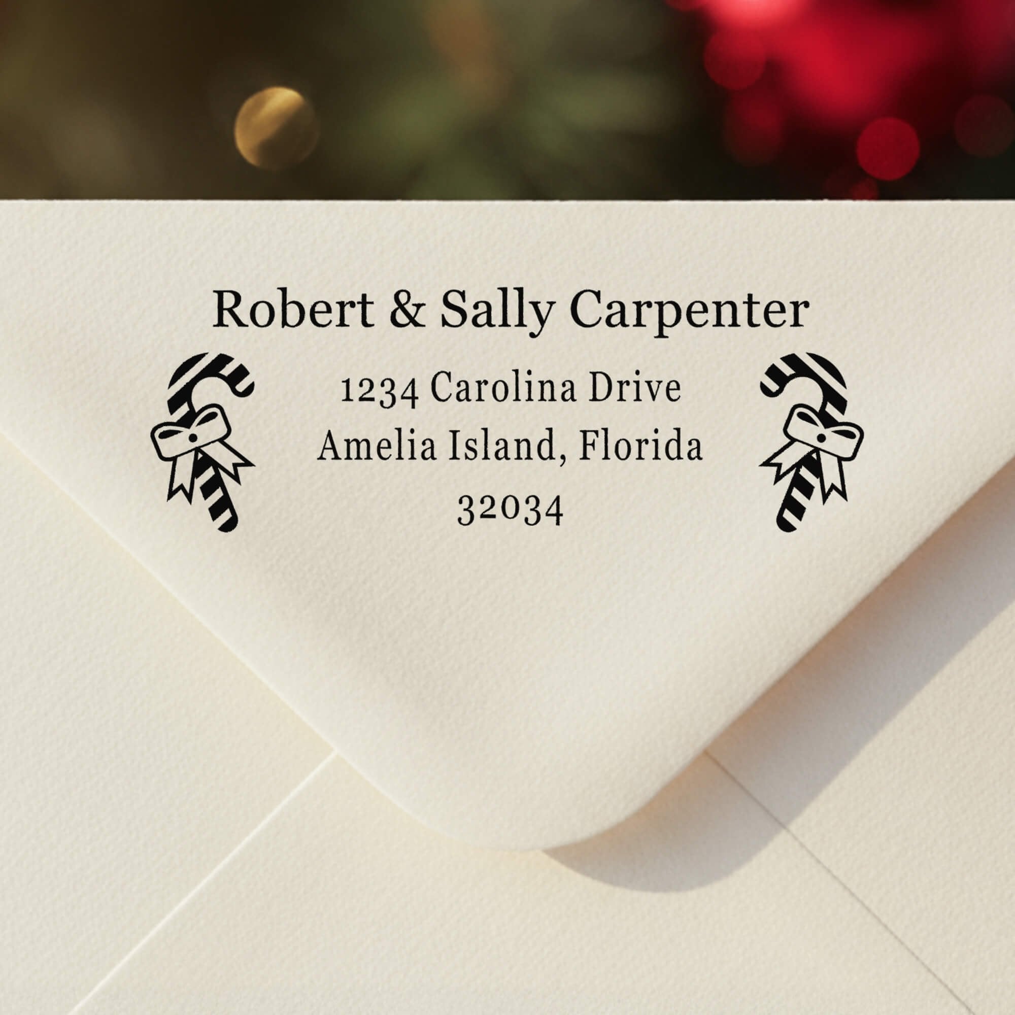 Personalized ‘Carpenter Candy Cane’ address stamp impression on envelope flap for holiday cards.
