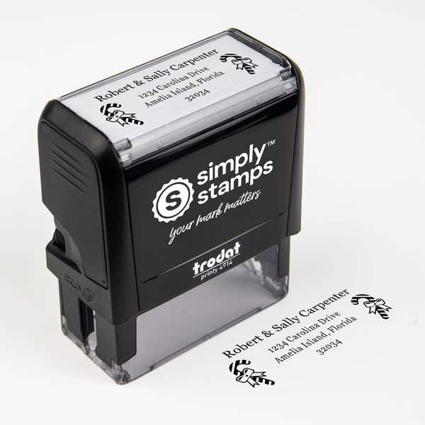 Top angle view of self-inking holiday stamp with circular ‘Carpenter Candy Cane’ address design.
