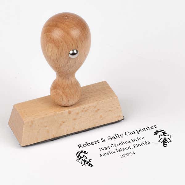 European wood hand stamp shown from above featuring custom ‘Carpenter Candy Cane’ holiday return address design.