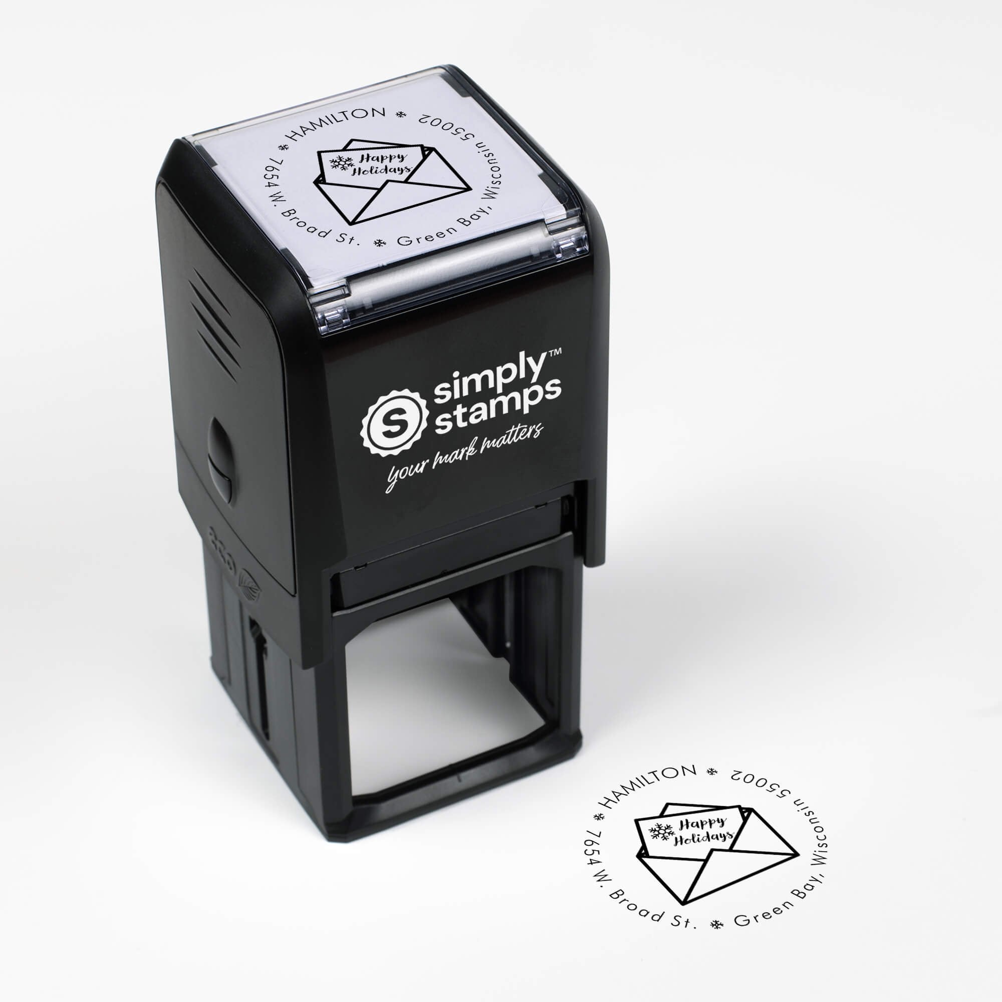 Top angle view of self-inking holiday stamp with circular ‘Happy Holidays Card’ address design.