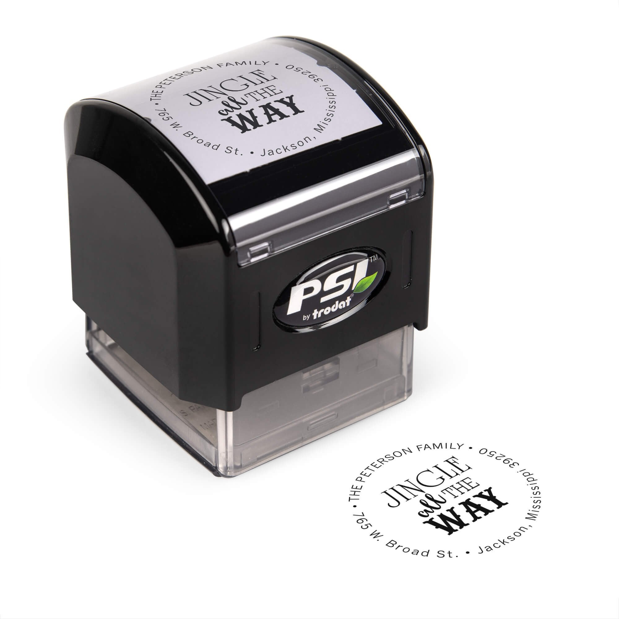 Pre-inked stamp shown from above featuring custom ‘Jingle All The Way’ holiday return address design.