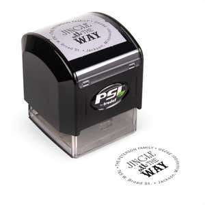 Pre-inked stamp shown from above featuring custom ‘Jingle All The Way’ holiday return address design.