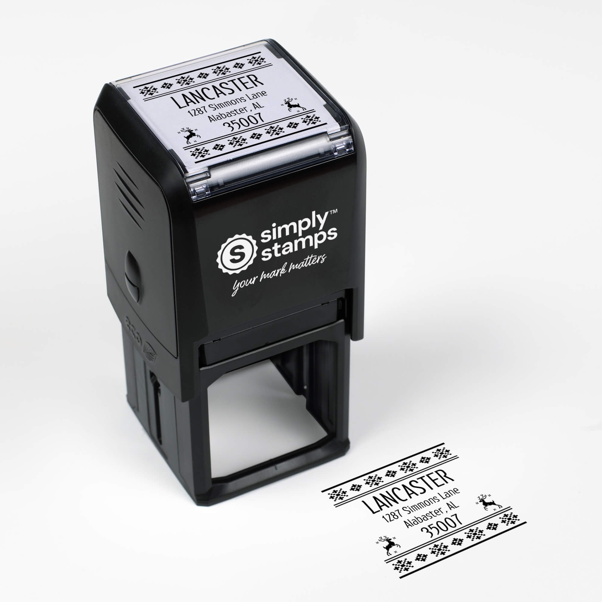 Top angle view of self-inking holiday stamp with ‘Designer Reindeer’ address design.