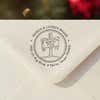 Personalized ‘North Pole’ address stamp impression on envelope flap for holiday cards.