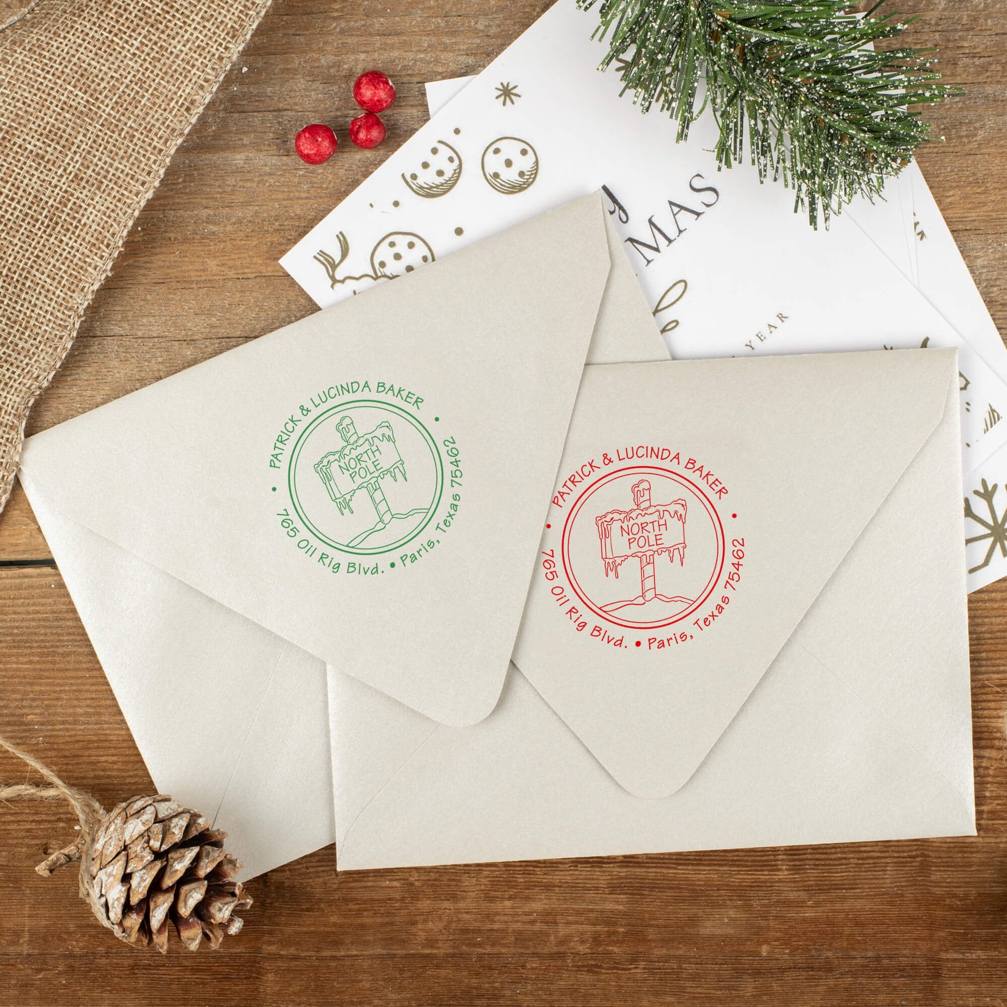 Green and red ink impressions of ‘North Pole’ return address stamp on Christmas envelopes.