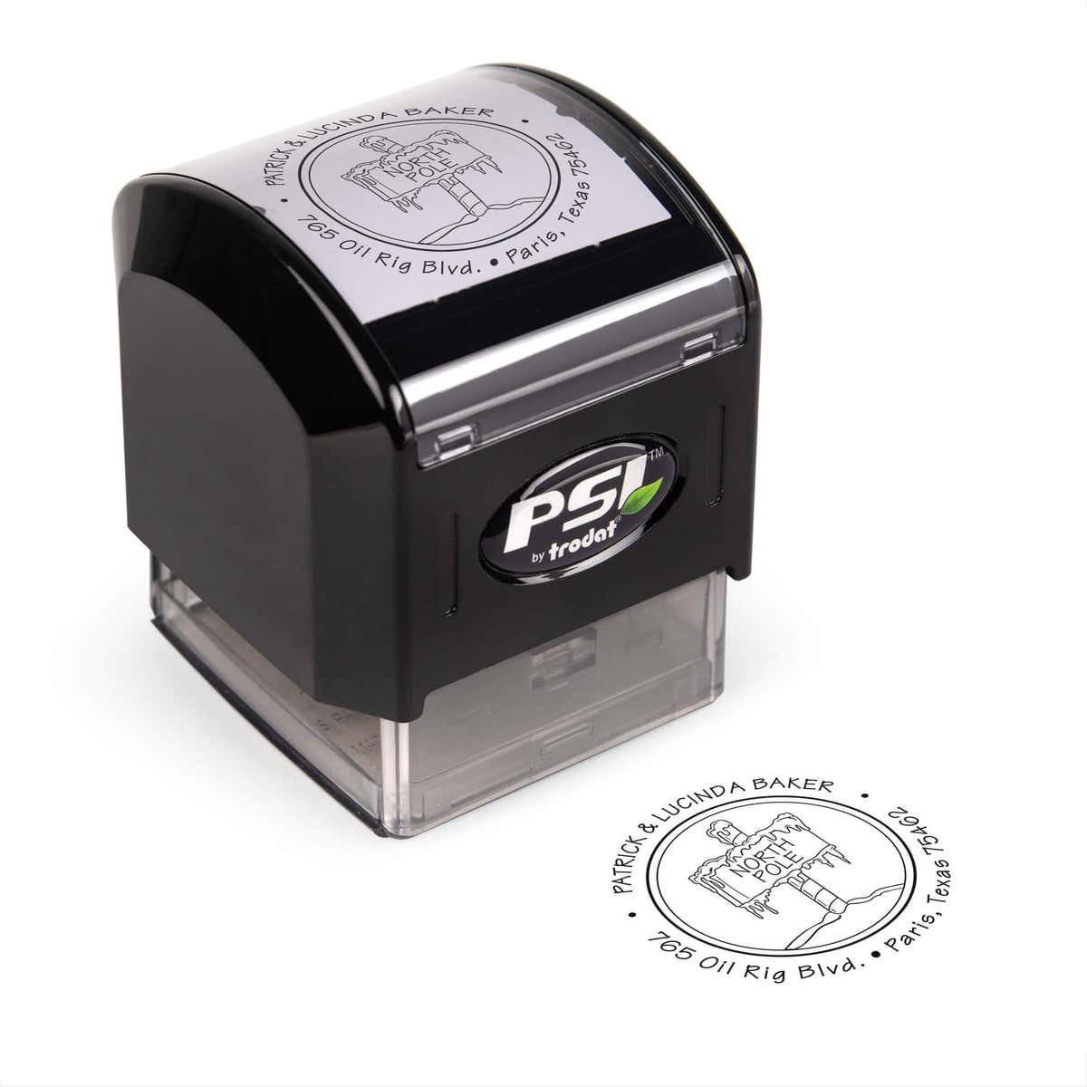 Pre-inked stamp shown from above featuring custom ‘North Pole’  holiday return address design.