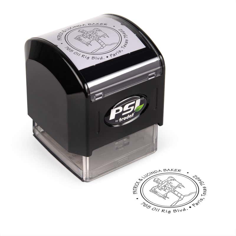 Pre-inked stamp shown from above featuring custom ‘North Pole’  holiday return address design.