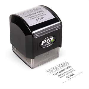 Pre-inked stamp shown from above featuring custom ‘Tis The Season’  holiday return address design.