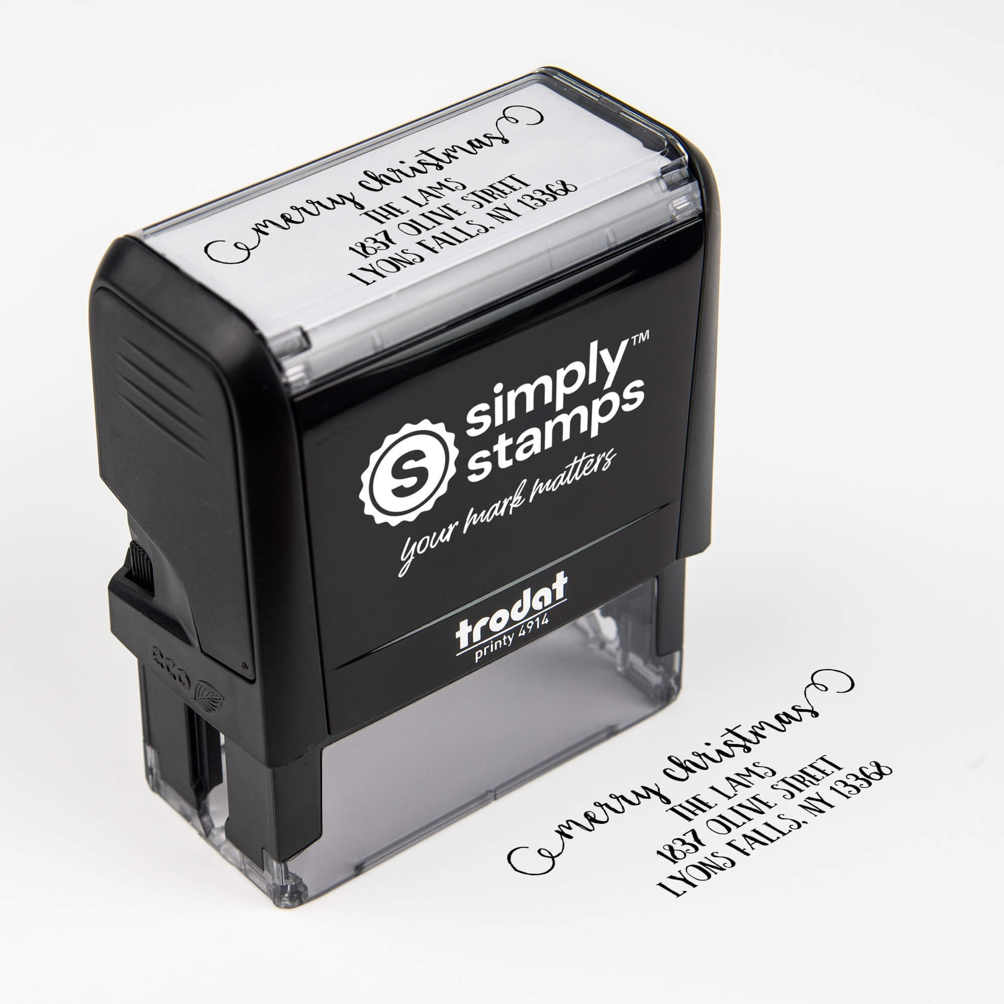 Top angle view of self-inking holiday stamp with circular ‘Merry Christmas Decorative Swirl’ address design.