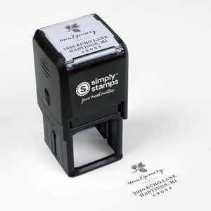Top angle view of self-inking holiday stamp with circular ‘Montgomery Pine Winter’ address design.