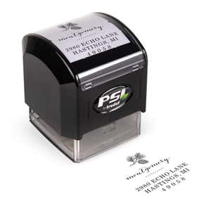 Pre-inked stamp shown from above featuring custom ‘Montgomery Pine Winter’  holiday return address design.