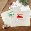 Green and red ink impressions of ‘Griswold Holiday’ return address stamp on Christmas envelopes.