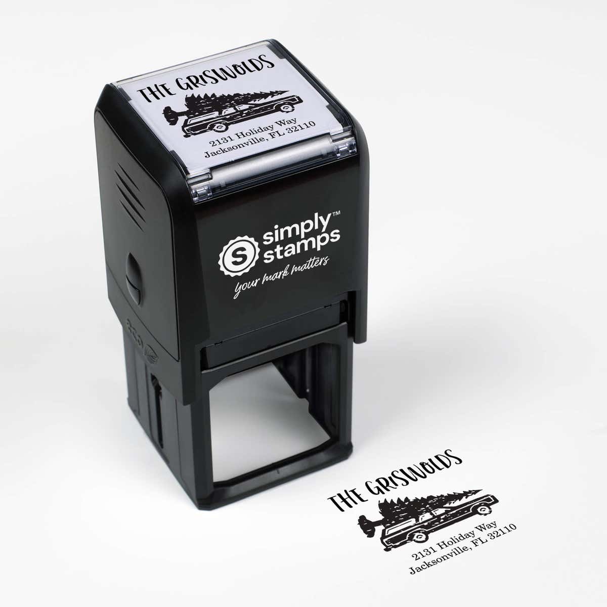 Top angle view of self-inking holiday stamp with circular ‘Griswold Holiday’ address design.