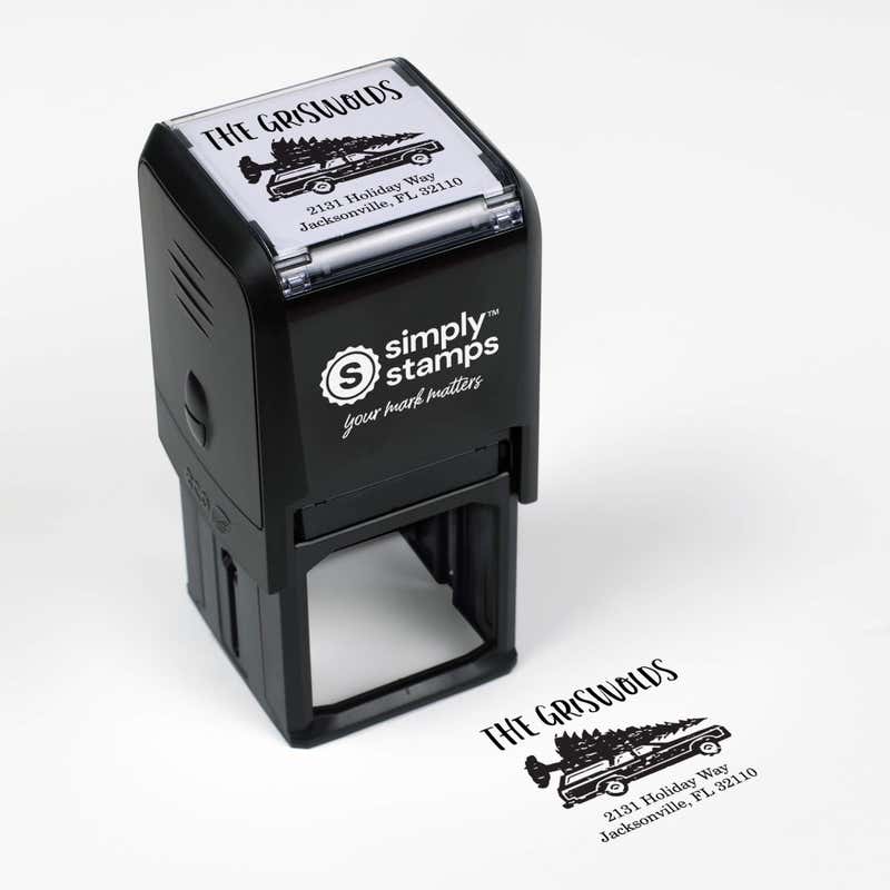 Top angle view of self-inking holiday stamp with circular ‘Griswold Holiday’ address design.