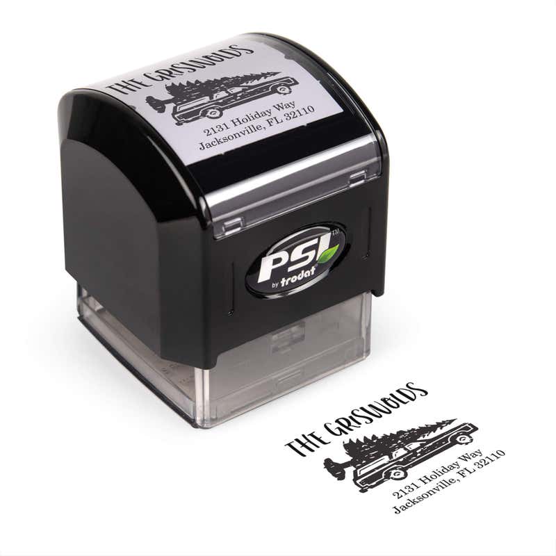 Pre-inked stamp shown from above featuring custom ‘Griswold Holiday’ holiday return address design.
