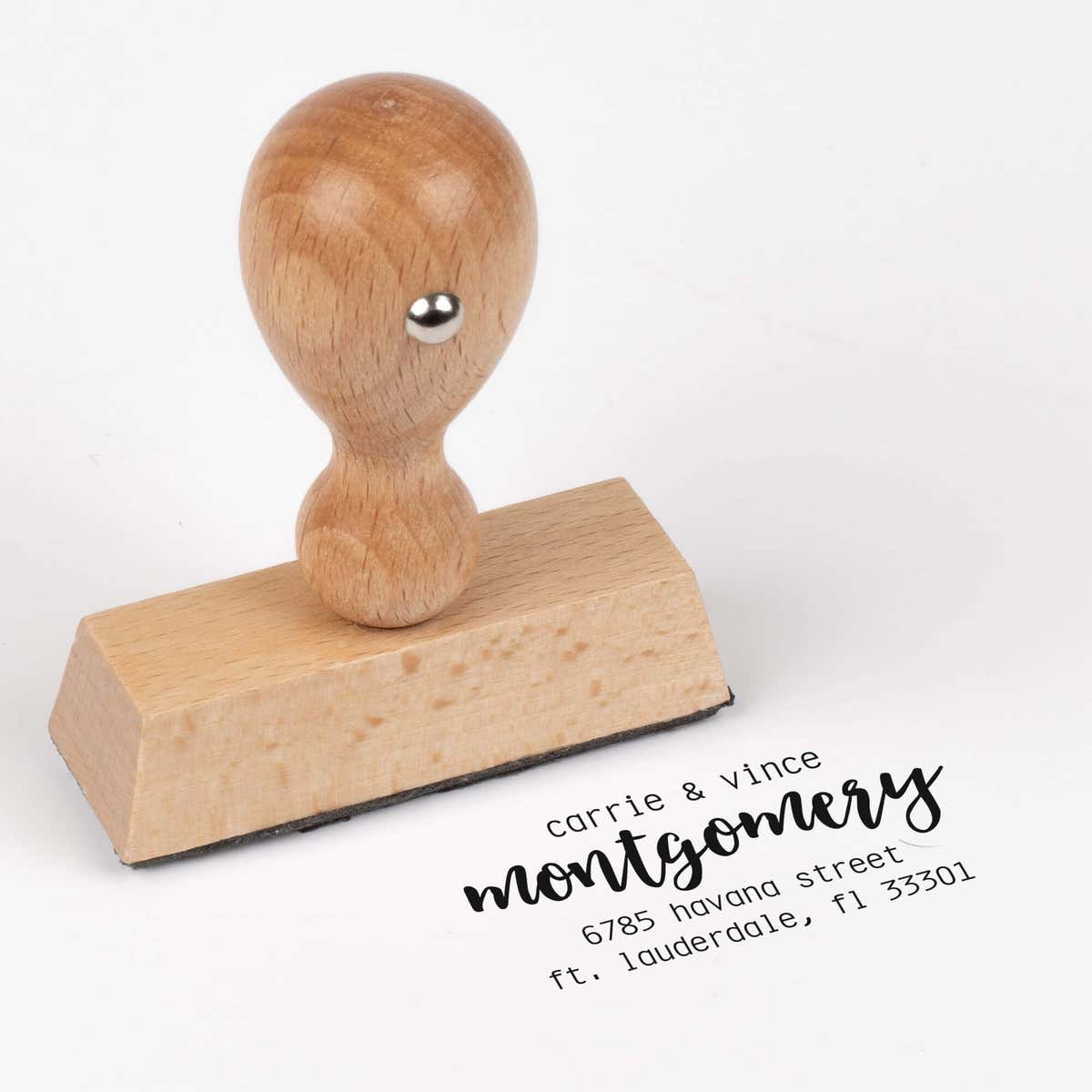 European wood hand stamp shown from above featuring custom ‘Montgomery Trendy’ holiday return address design.