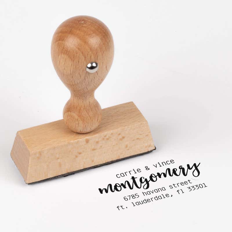 European wood hand stamp shown from above featuring custom ‘Montgomery Trendy’ holiday return address design.