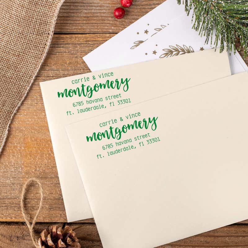 Green ink impressions of ‘Montgomery Trendy’ return address stamp on Christmas envelopes.