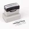 Pre-inked stamp shown from above featuring custom ‘Montgomery Trendy’  holiday return address design.