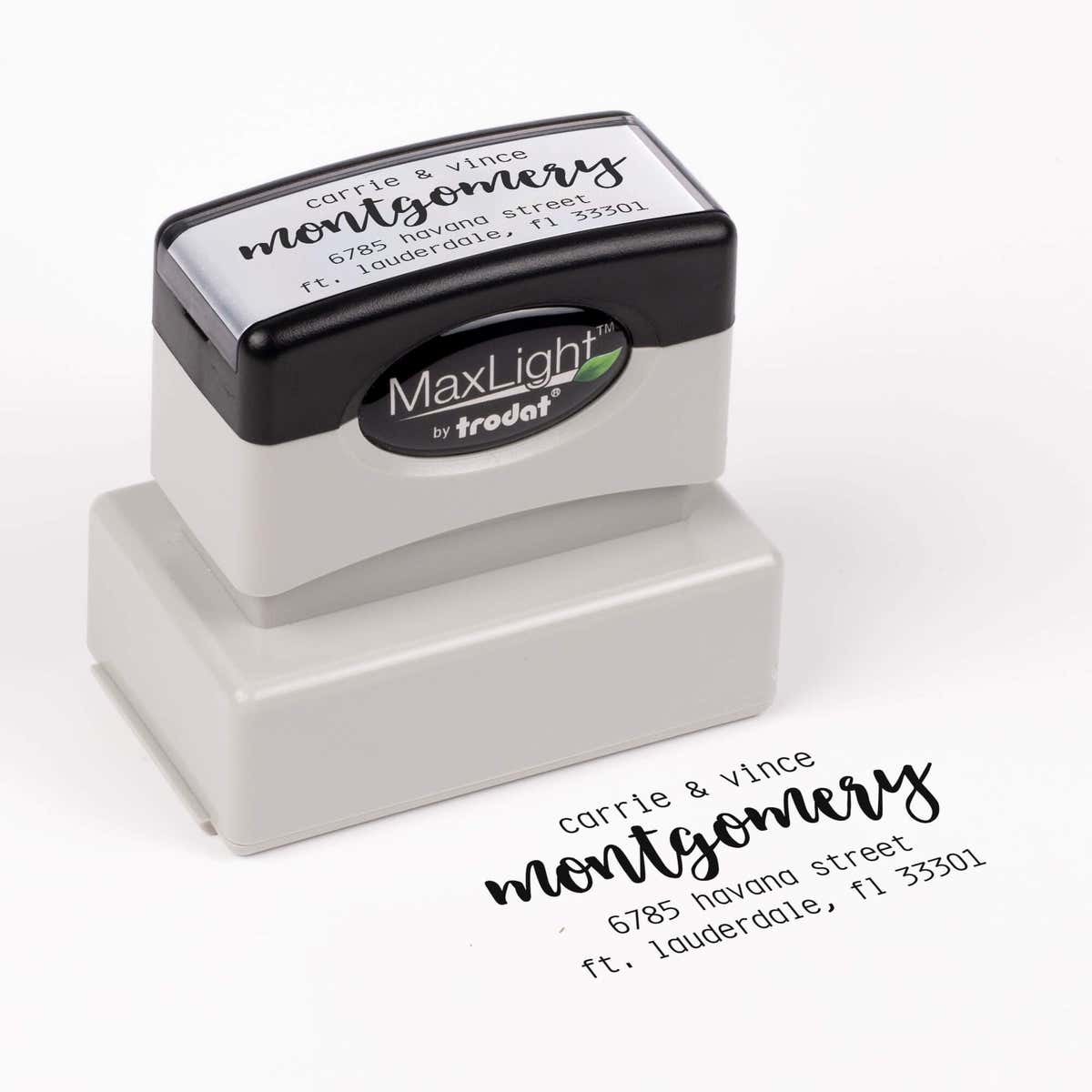 Pre-inked stamp shown from above featuring custom ‘Montgomery Trendy’  holiday return address design.