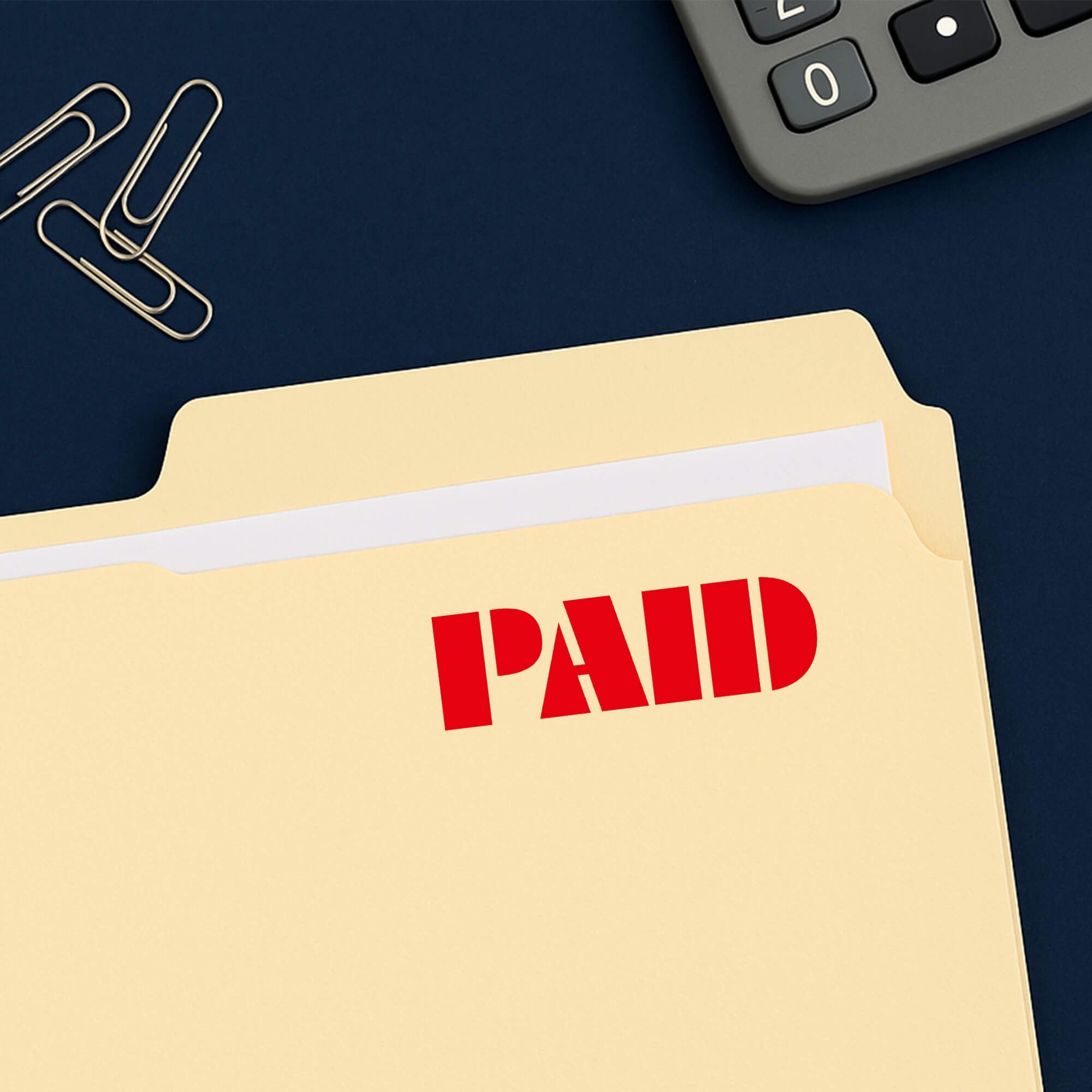 Paid stamped in red on a folder