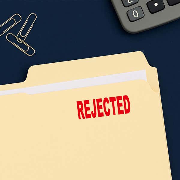 REJECTED stamped in red on a manila file folder for records processing