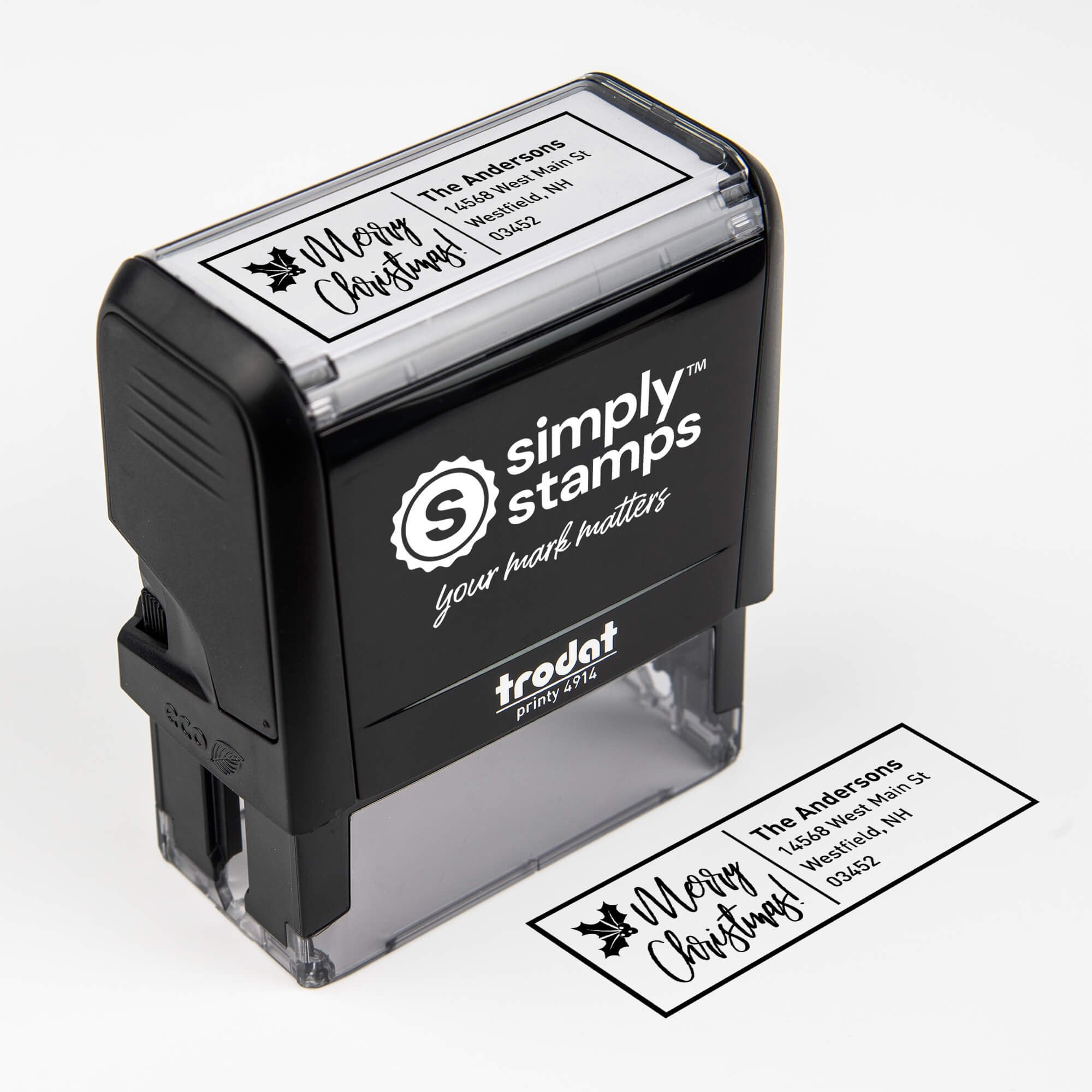 Top angle view of self-inking holiday stamp with ‘Merry Christmas With Poinsettia’ address design.