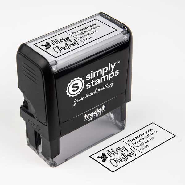 Top angle view of self-inking holiday stamp with ‘Merry Christmas With Poinsettia’ address design.
