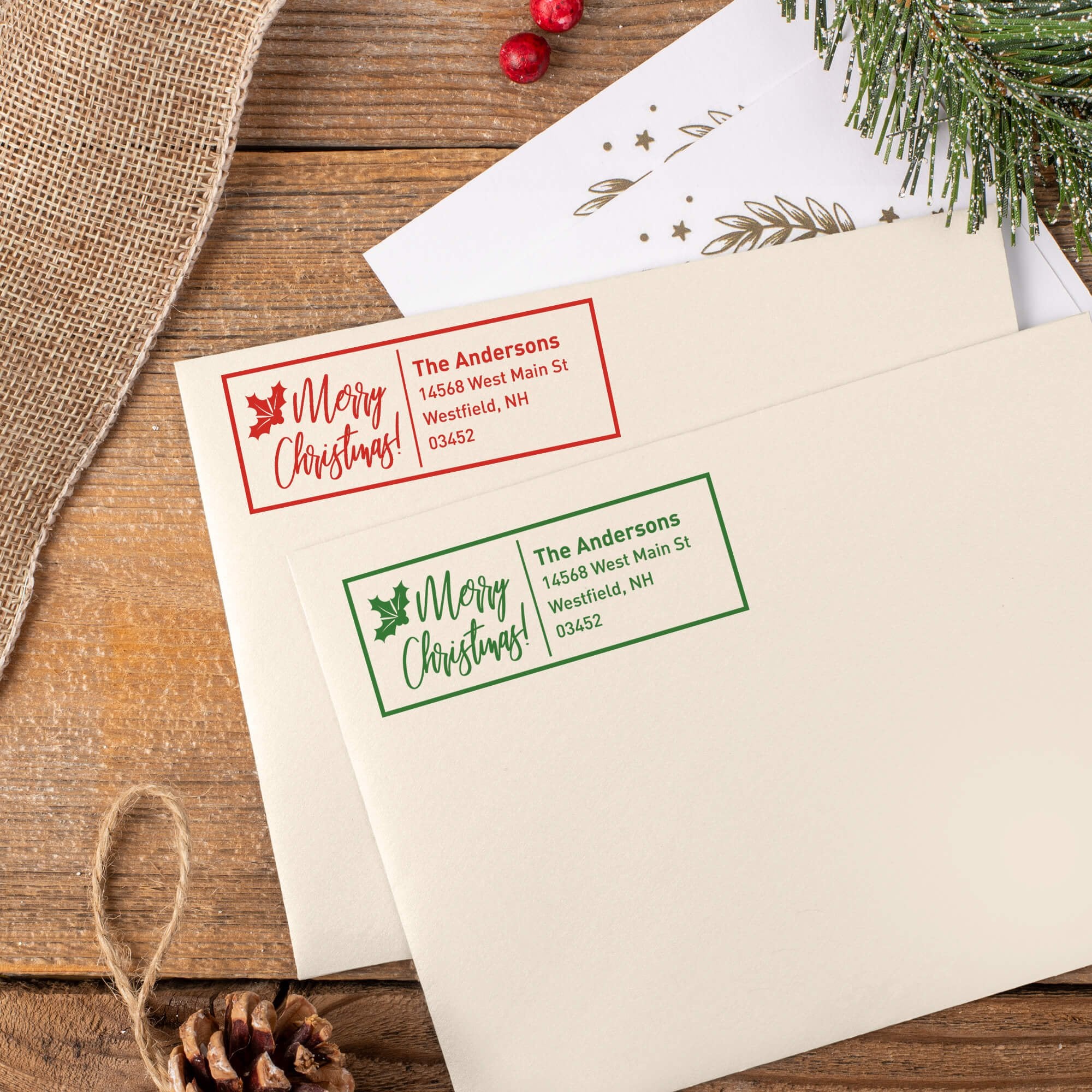 Green and red ink impressions of ‘Merry Christmas With Poinsettia’ return address stamp on Christmas envelopes.