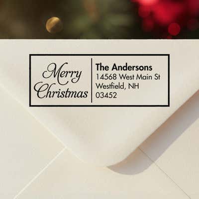 Personalized ‘Merry Christmas Scripted’ address stamp impression on envelope flap for holiday cards.
