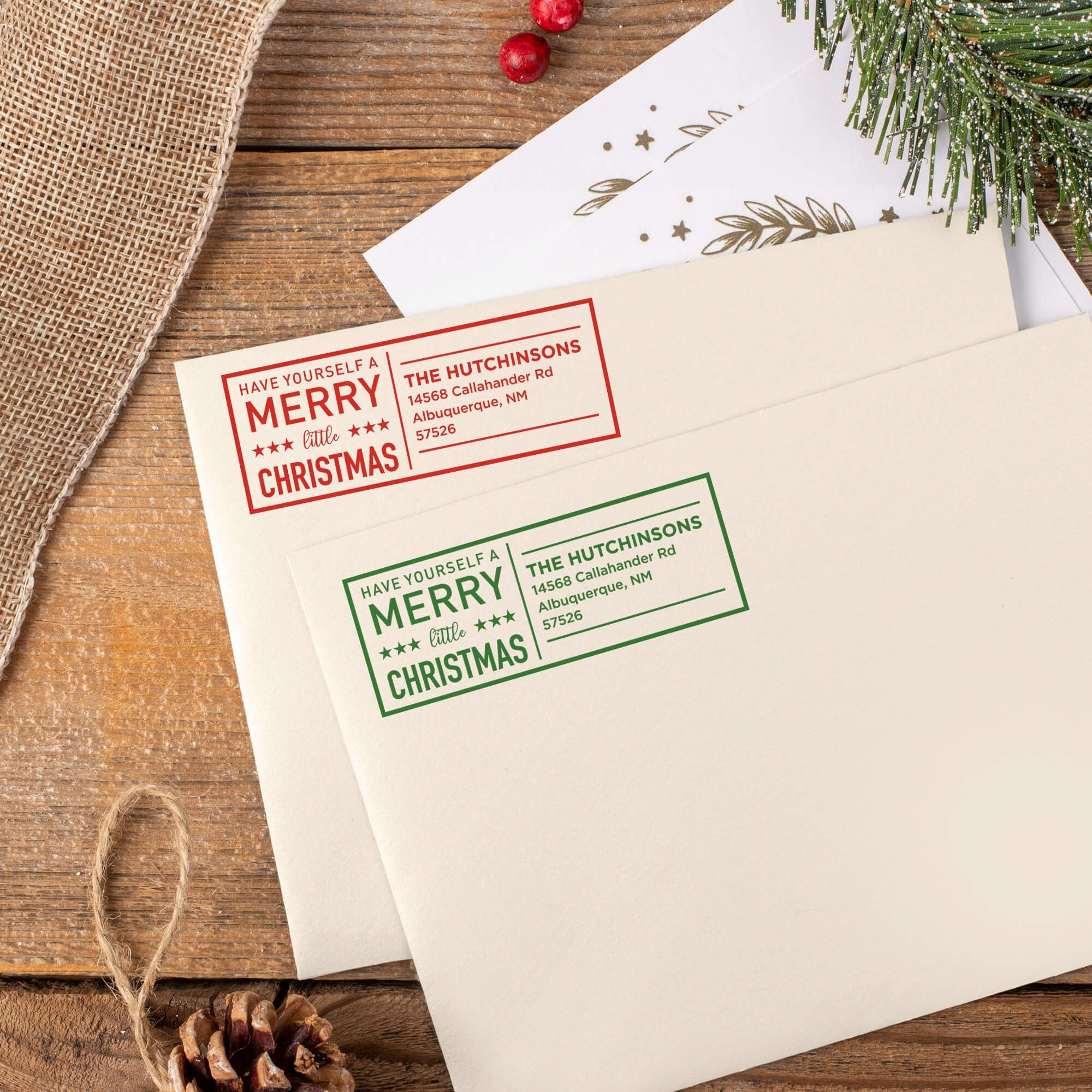 Green and red ink impressions of ‘Have Yourself A Merry Little Christmas’ return address stamp on Christmas envelopes.