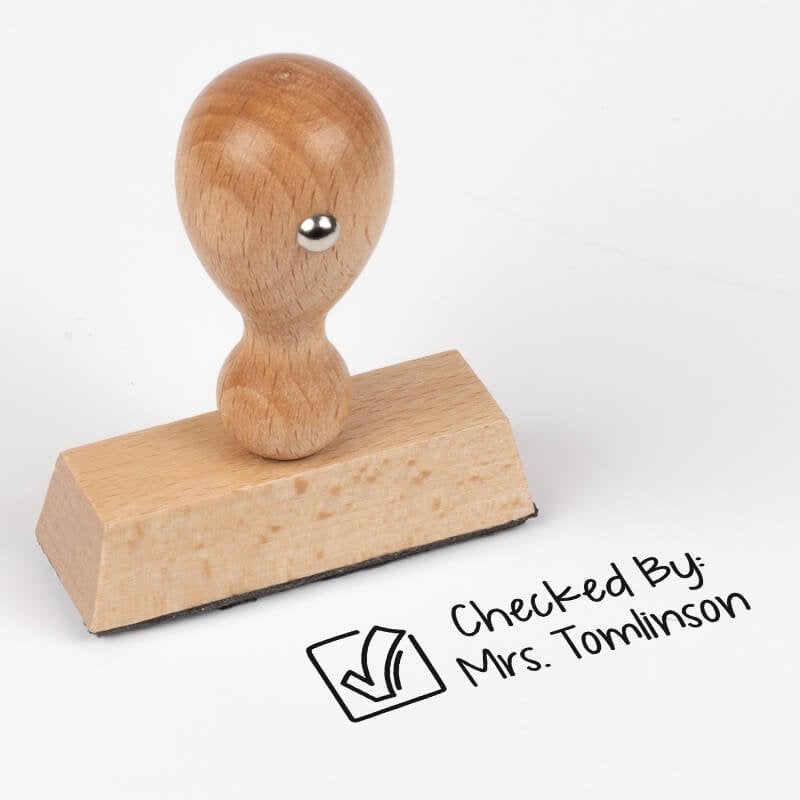 Wood handle teacher stamp with copy, "checked by:"