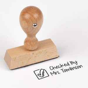 Wood handle teacher stamp with copy, "checked by:"