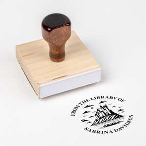 Wood handle stamp body with book stamp impression