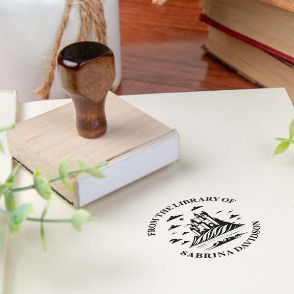 Custom book stamp on paper with wood handle stamp body