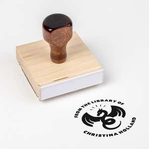 Wood handle stamp body with book stamp impression