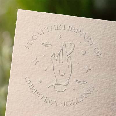 Enchanted custom book embosser impression on paper