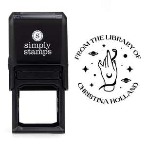 Front view of self-inking stamp body with library book stamp impression example