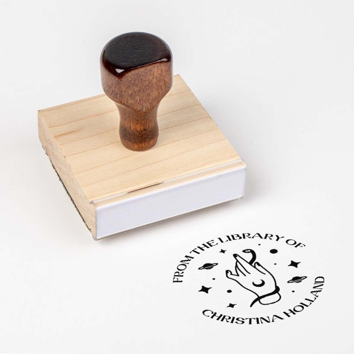 Wood handle stamp body with book stamp impression
