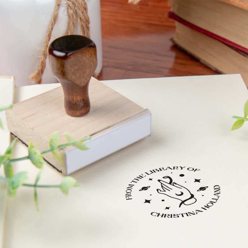 Custom book stamp on paper with wood handle stamp body
