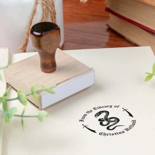 Custom book stamp on paper with wood handle stamp body