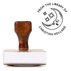 Front view of wood handle stamp body with library book stamp impression