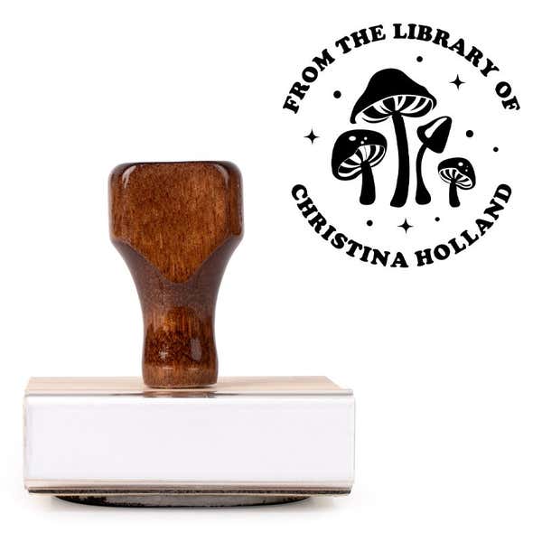Front view of wood handle stamp body with library book stamp impression
