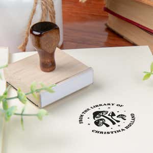 Custom book stamp on paper with wood handle stamp body