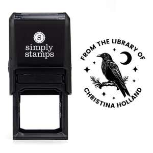 Front view of self-inking stamp body with library book stamp impression example