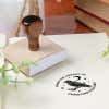 Custom book stamp on paper with wood handle stamp body