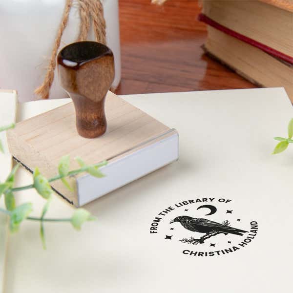 Custom book stamp on paper with wood handle stamp body